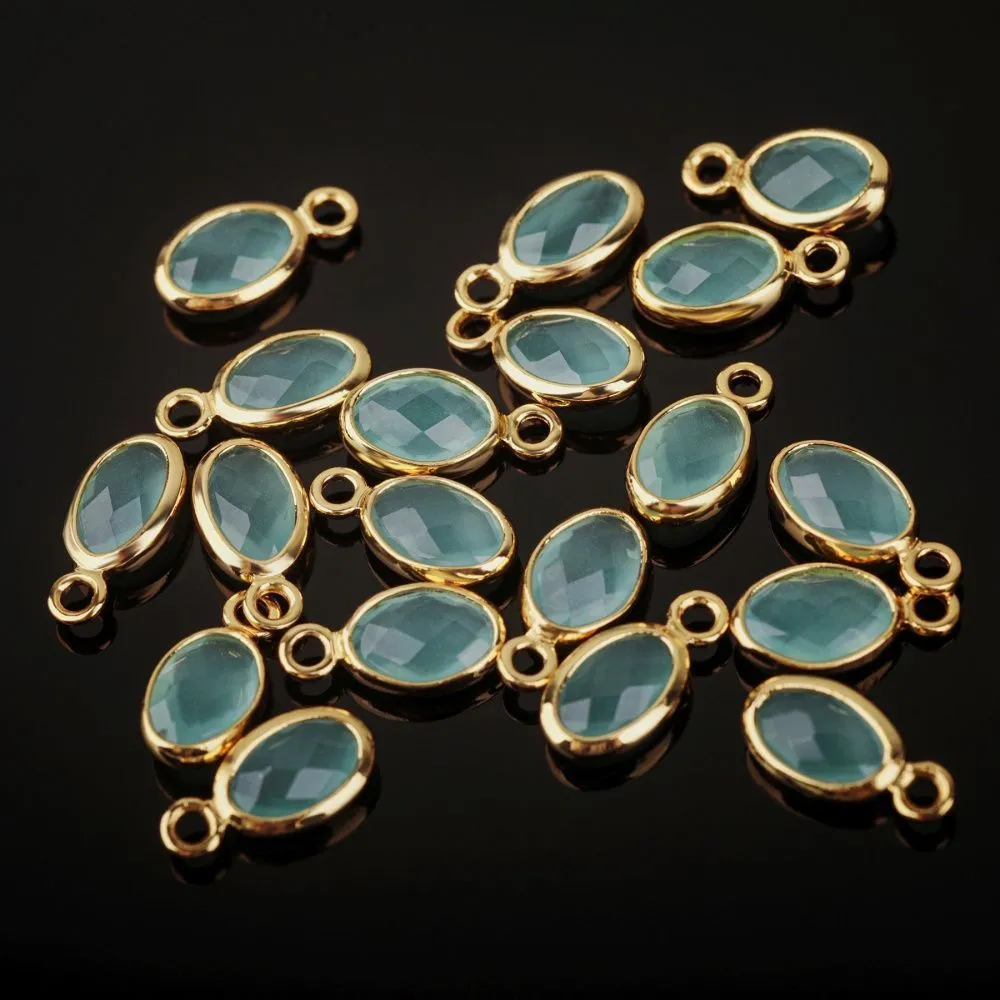 подвеска металл "эллипс", позолота/св.аквамарин, 9x4.5x2 мм